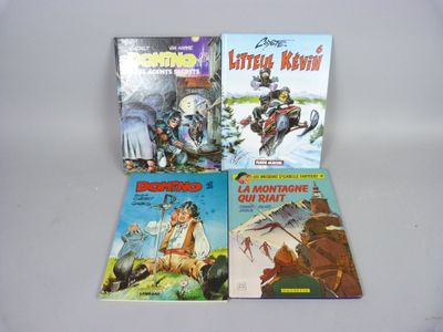 trois livres pour enfants sont posés sur une surface blanche