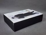 the box is black and white with a picture of a man in a suit on it