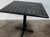 an image of a square table with a black top