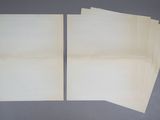 several pieces of paper are stacked on top of each other