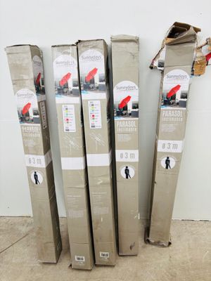 four cardboard boxes stacked on top of each other on the floor