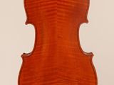 an old violin with a wooden back and a long neck