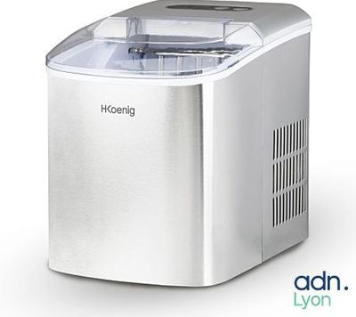 a close up of a small ice maker on a white background