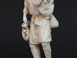 statue of a man carrying a child on his back