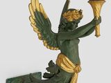une statue d'ange tenant une bougie, fixée au mur