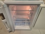an open refrigerator with a lot of food inside of it