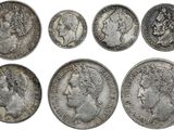 un ensemble de six pièces d'argent sur lesquelles figurent des portraits d'hommes et de femmes