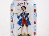 a glass bottle with a picture of a man on it