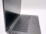 a laptop that is sitting on a white surface