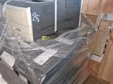 a pile of computer equipment sitting on top of a pile of plastic