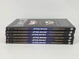 five star wars books stacked on top of each other on a white surface