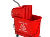 a picture of a red mop bucket with a handle