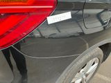 a black car with a sticker on the side of it
