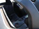 the interior of a car with black leather seats and a steering wheel