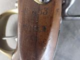 a close up of a gun that is on display