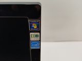 a close up of a black computer on a white table