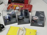 a yellow toy car and other toy items on a table