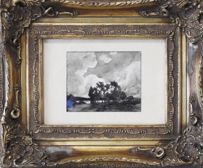 painting of a landscape in a gold frame on a wall