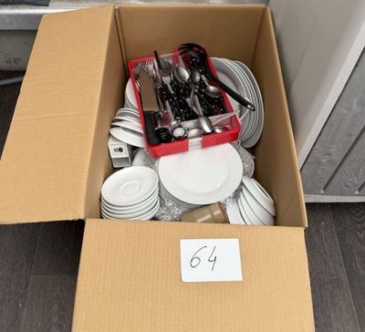 a box full of silver and white plates and utensils