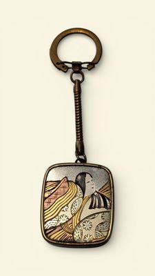 an image of a keychain with a picture of a bird on it