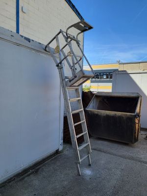 a ladder that is leaning against a wall