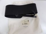 the black belt is laying on top of a white bag