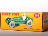 a box of dinky toys with a dog in a car