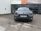 the front of a grey citrole parked in front of a building