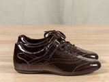 a close up of a pair of brown shoes on a table