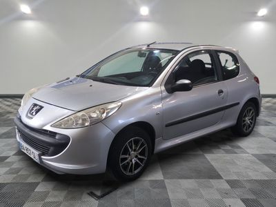 the small silver car is parked in the garage on a checkered floor