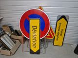 two signs that are next to each other on the floor