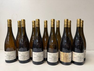 six bottles of wine lined up in a row on a table
