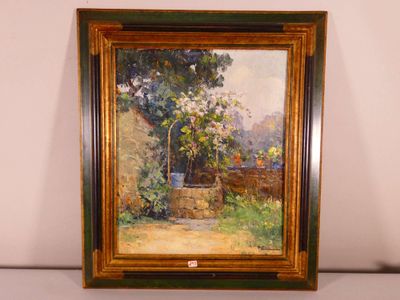 an oil painting of a garden scene in a frame on a table