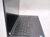 a laptop computer that is open on a white surface