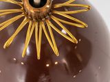 a chocolate apple with a candle in it on a table