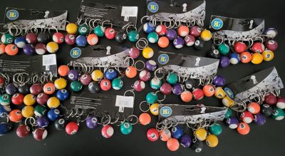 a lot of different colored beads on a black surface