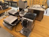 many different types of coffee machines on the table