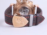 a watch that is on a brown leather strap