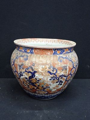 a vase that is sitting on a black surface