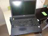 a laptop computer that is sitting on a desk