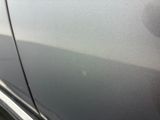 the door handle of a car with a sticker on it