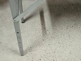 a white table with a metal frame on it