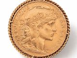 an image of a gold coin with a woman ' s head on it