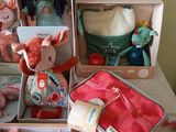 a lot of stuffed animals in a box on the floor