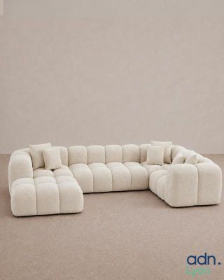 an image of a white couch with pillows on top of it