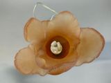 a close up of a flower on a wire