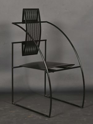 a black chair with a metal frame and a black seat