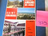 a book with a picture of a building and a post it note on it