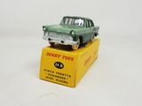 toy car on a box on a white surface with a white background