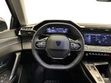 the interior of a car with a steering wheel and dashboard controls